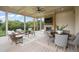 Screened porch with fireplace, dining area, wicker furniture, ceiling fan, and view at 1641 Legacy Ridge Ln, Wake Forest, NC 27587