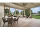 Screened porch with outdoor dining area, seating, ceiling fan, and view of greenery at 1641 Legacy Ridge Ln, Wake Forest, NC 27587