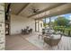 Screened porch with dining and sitting area, ceiling fan, and view of the yard at 1641 Legacy Ridge Ln, Wake Forest, NC 27587