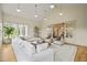 Bright sunroom with vaulted ceilings, sectional sofa, and access to another room at 1641 Legacy Ridge Ln, Wake Forest, NC 27587