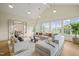 Large sunroom with vaulted ceiling, numerous windows, and comfortable seating area at 1641 Legacy Ridge Ln, Wake Forest, NC 27587