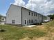 Gray siding house with a backyard patio and landscaping at 3125 Ranger Dr # 42, Durham, NC 27703