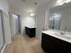 Double vanity bathroom with dark cabinets and a large shower at 3125 Ranger Dr # 42, Durham, NC 27703