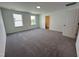 Spacious bedroom with neutral carpet and access to a bathroom at 3125 Ranger Dr # 42, Durham, NC 27703