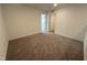 Bright bedroom with neutral carpeting and two windows at 3125 Ranger Dr # 42, Durham, NC 27703