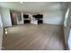 Open living room with kitchen, island, and hardwood floors at 3125 Ranger Dr # 42, Durham, NC 27703