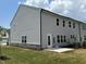 Gray siding house with a backyard patio and landscaping at 3125 Ranger Dr # 42, Durham, NC 27703