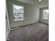 Bright bedroom with carpet and large windows at 3125 Ranger Dr # 42, Durham, NC 27703
