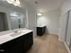 Double vanity bathroom with modern finishes at 3125 Ranger Dr # 42, Durham, NC 27703