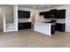 Eat-in kitchen with island, dark cabinetry, and stainless steel appliances at 3125 Ranger Dr # 42, Durham, NC 27703