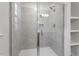 Clean shower with gray tile and glass enclosure at 632 Georgias Landing Pkwy, Raleigh, NC 27603