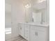 Double vanity bathroom with white cabinets and mirror at 46 Nailsworth St, Angier, NC 27501