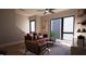 Living Room with a leather couch and a ceiling fan, featuring large windows at 512 Gordon St # 407, Durham, NC 27701