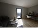 Home office with a desk, chair, and access to a balcony at 512 Gordon St # 407, Durham, NC 27701