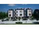 Modern three-story townhome building with dark gray and white exterior and landscaping at 512 Gordon St # 407, Durham, NC 27701