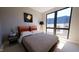 Cozy bedroom with a leather headboard and large windows at 512 Gordon St # 407, Durham, NC 27701