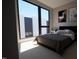 Spacious bedroom with large windows and plush bedding at 512 Gordon St # 407, Durham, NC 27701