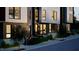 Evening view of a modern townhome, showcasing its exterior design and front entrance at 512 Gordon St # 407, Durham, NC 27701