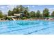 Resort-style pool with a waterslide and plenty of lounge chairs at 11548 Helmond Way # 116, Raleigh, NC 27617