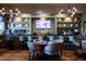 Upscale bar with seating and a large TV at 420 White Mulberry Ln, Holly Springs, NC 27540