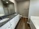 Double vanity bathroom with granite countertops and a soaking tub at 86 Scotties Ridge Dr, Princeton, NC 27569