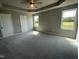 Spacious bedroom with carpeted floors and ceiling fan at 86 Scotties Ridge Dr, Princeton, NC 27569
