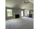 Spacious living room with fireplace, vaulted ceiling, and carpeted floor at 114 Scotties Ridge Dr, Princeton, NC 27569