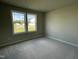 Bedroom with neutral carpeting and two large windows at 114 Scotties Ridge Dr, Princeton, NC 27569