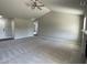 Spacious living room with carpeting and a fireplace at 114 Scotties Ridge Dr, Princeton, NC 27569