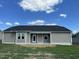 House exterior showcasing a rear porch and landscaped yard at 114 Scotties Ridge Dr, Princeton, NC 27569
