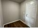 Simple foyer with wood-look flooring and white door at 114 Scotties Ridge Dr, Princeton, NC 27569