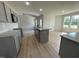 Open concept kitchen with granite countertops and gray cabinetry at 144 Scotties Ridge Dr, Princeton, NC 27569