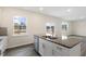 Kitchen island with granite countertop and stainless steel dishwasher at 1033 Leo Minor Ln, Wendell, NC 27591