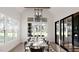 Bright dining room with a large table and access to a patio at 3709 Joyful Creek Trl, Zebulon, NC 27597