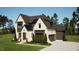 Stunning two-story home with a brick facade and attached garage at 3709 Joyful Creek Trl, Zebulon, NC 27597