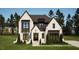 Two-story modern home with a stylish facade at 3709 Joyful Creek Trl, Zebulon, NC 27597