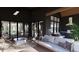 Covered patio with built-in grill and comfortable seating area at 3709 Joyful Creek Trl, Zebulon, NC 27597