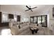Open concept living room with a comfortable sectional sofa at 3709 Joyful Creek Trl, Zebulon, NC 27597