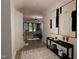 Bright and airy foyer with a view into the living room and modern art pieces at 3709 Joyful Creek Trl, Zebulon, NC 27597