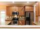 Updated kitchen, featuring stainless steel appliances and granite countertops at 3331 Lazy Ln, Graham, NC 27253