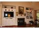 Spacious living room with a fireplace and built-in shelving at 3331 Lazy Ln, Graham, NC 27253
