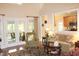 Spacious living room featuring a cozy sitting area and views into the kitchen at 3331 Lazy Ln, Graham, NC 27253