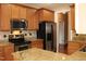 Modern kitchen with stainless steel appliances and granite countertops at 3331 Lazy Ln, Graham, NC 27253