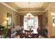 Bright dining room with a chandelier and large windows at 3331 Lazy Ln, Graham, NC 27253