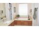 Relaxing bathroom with a soaking tub and granite vanity at 3331 Lazy Ln, Graham, NC 27253