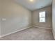 Simple bedroom with window and neutral wall color at 3635 Water Mist Ln, Raleigh, NC 27604