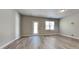Spacious living room with vinyl plank flooring and door access to backyard at 3635 Water Mist Ln, Raleigh, NC 27604