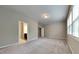 Spacious bedroom with neutral carpeting and large windows at 3635 Water Mist Ln, Raleigh, NC 27604