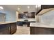 Modern kitchen with dark cabinetry and quartz countertops at 3635 Water Mist Ln, Raleigh, NC 27604