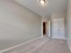 Well-lit bedroom with double door closet and carpet at 3635 Water Mist Ln, Raleigh, NC 27604